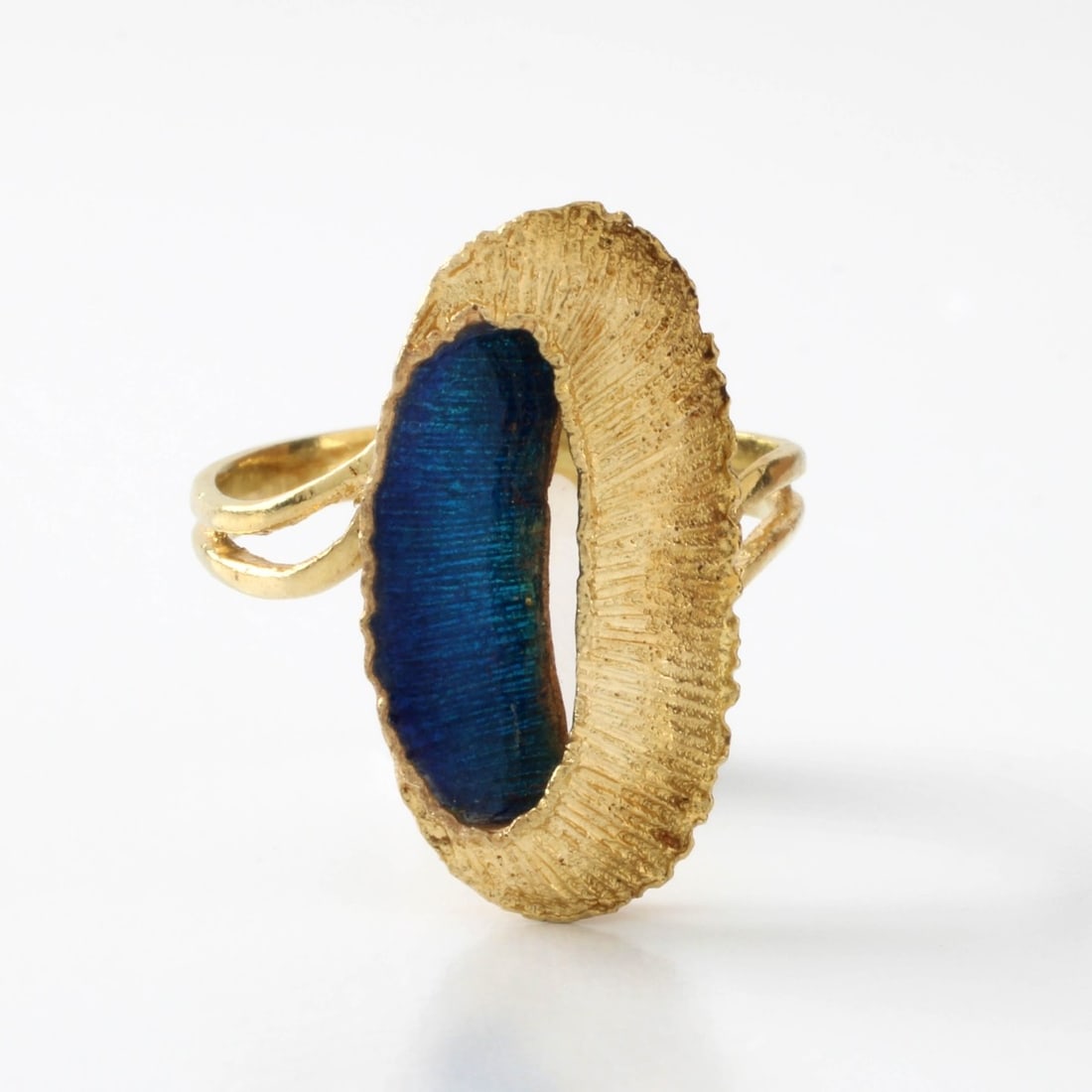 18K and Enamel Ring: Vintage 18 Karat Yellow Gold and Blue Enamel Ring. Stamped 750. Ring size 7-3/4. Approx. weight: 4.86 grams. Kodner Galleries offers phone and absentee bidding at a low, flat 21% buyer?s premium