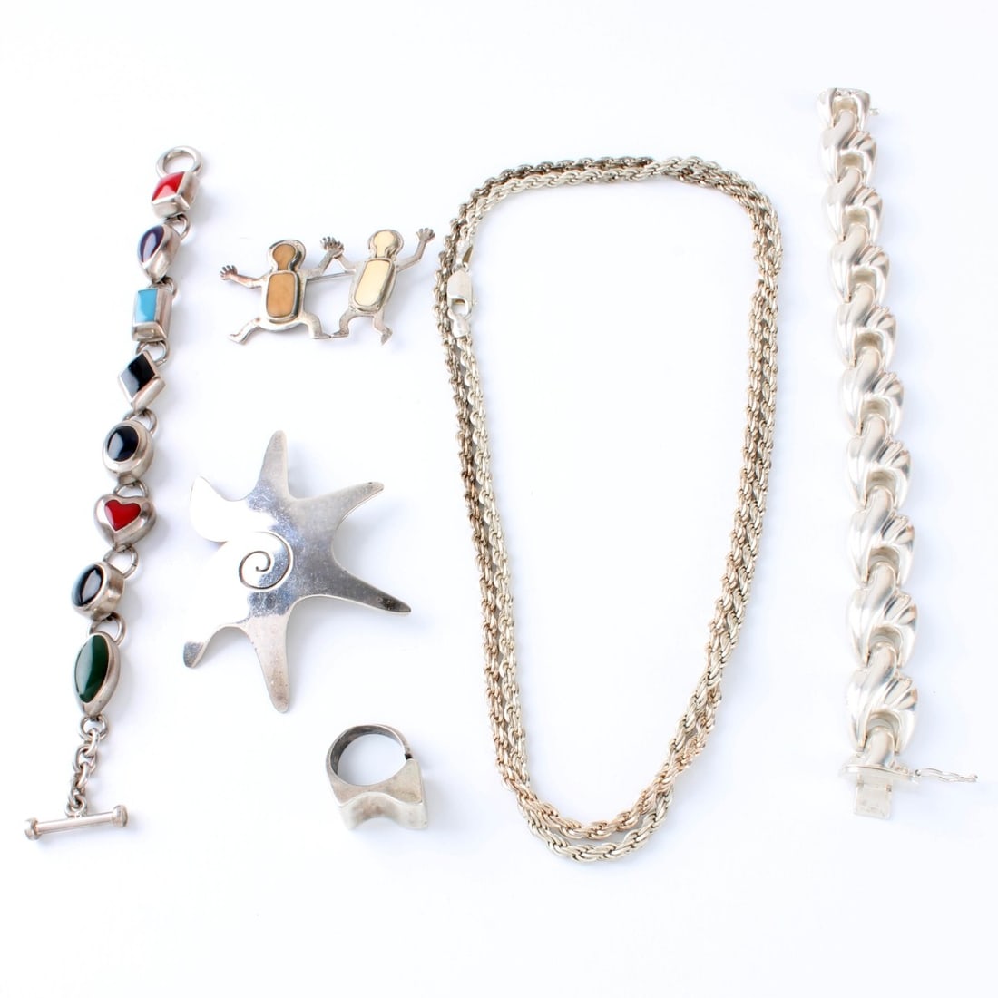 Sterling Silver Jewelry: Vintage Sterling Silver Jewelry. To include one chain / necklace, two bracelets, two pins and one ring. Stamped 925 or 950, ring is not stamped. One bracelet with multi color hardstones. Chain / neckl