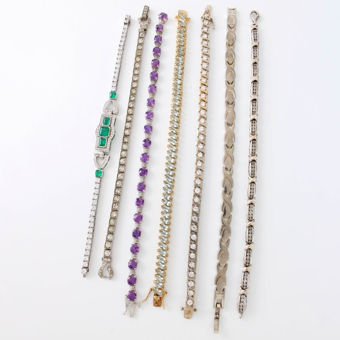 Sterling Silver Bracelets: Sven (7) Vintage Sterling Silver Bracelets. Most set with color stones and faux diamonds. Stamped 925 or Sterling. Longest measures 7-1/4" L. Approx. total weight: 100.52 grams. Kodner Galleries