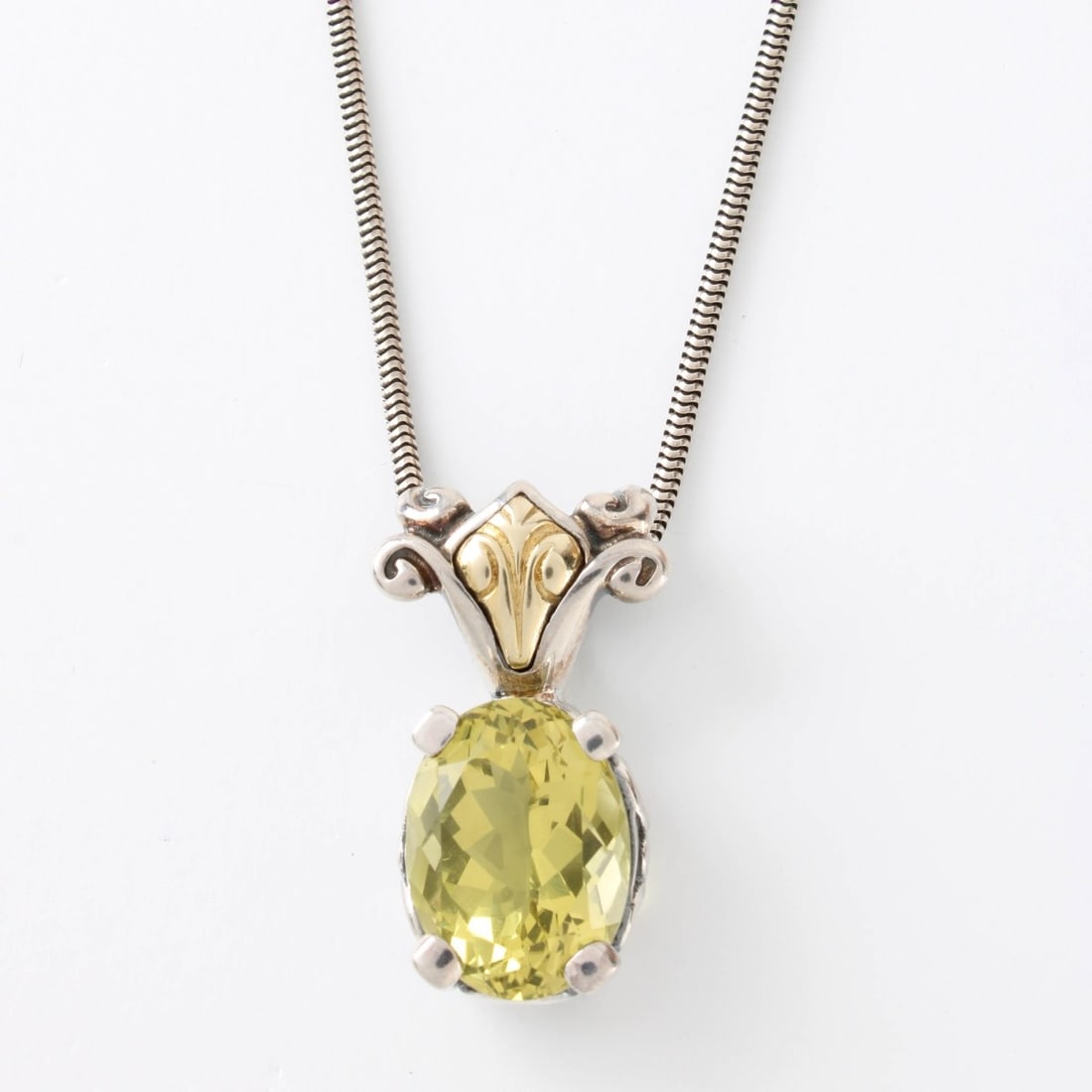Sterling 18K and Gemstone Necklace: Vintage Sterling Silver, 18 Karat Yellow Gold and Yellow Gemstone Pendant Necklace. Pendant stamped 925 18K. Clasp stamped 925. Pendant measures 1-1/8" L, 5/8" W; chain measures 17" L, Approx. total w