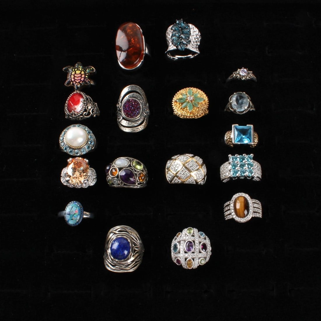 Sterling Rings: Collection of Eighteen (18) Vintage Sterling Silver Rings. Variously accented with color stones, faux diamonds, pearl and hardstones.. Rings sizes 6 to 9. Approx. total weight: 145.76 grams.