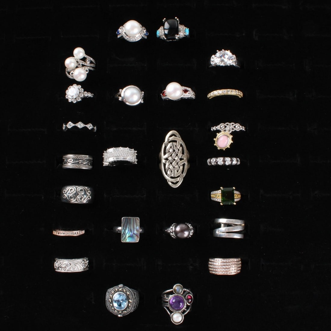 Sterling Rings: Collection of Twenty-four (24) Vintage Sterling Silver Rings. Variously accented with color stones, faux diamonds, pearls and hardstones. Rings sizes 4-3/4 to 7. Approx. total weight: 127.91 grams.