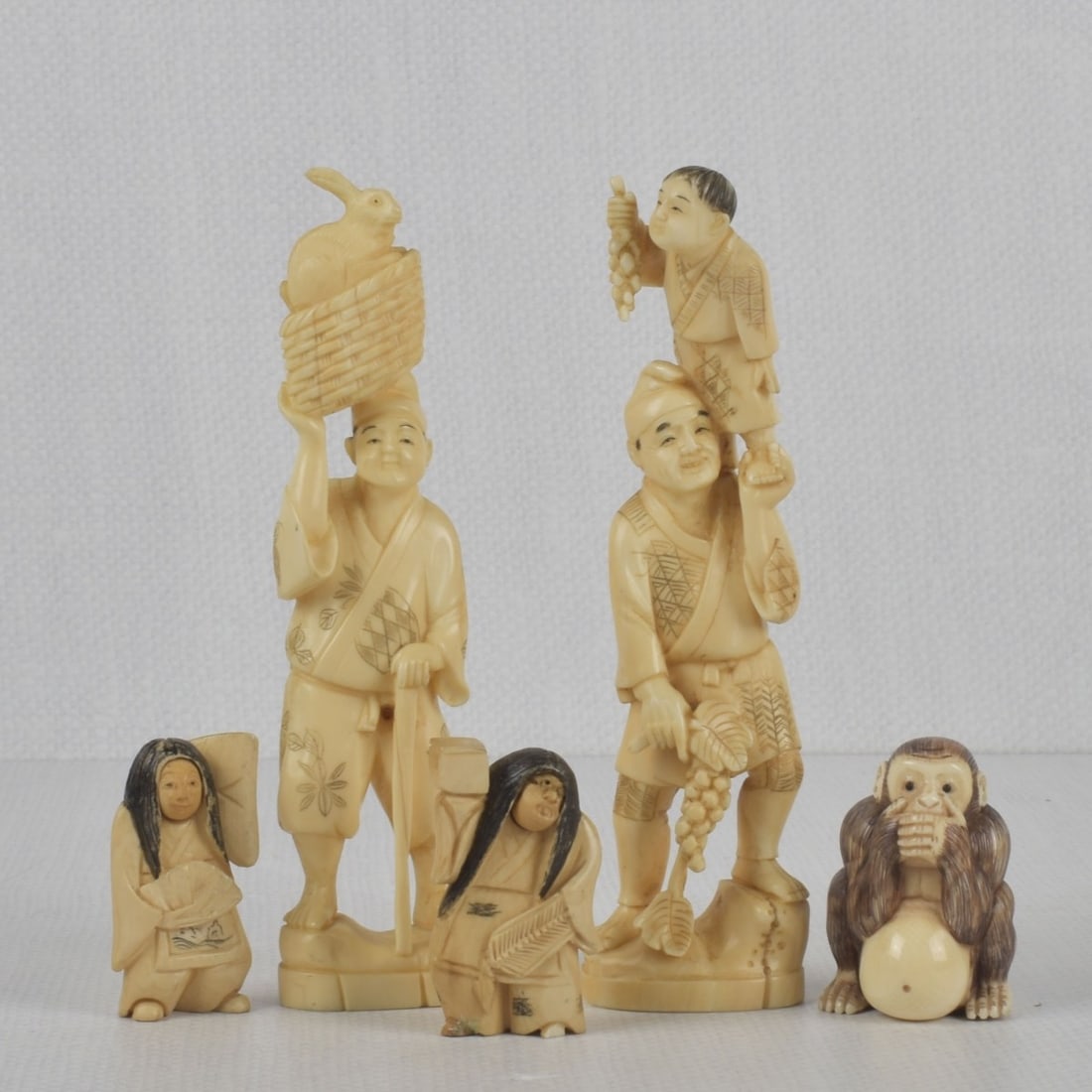 Antique Carved Japanese Figures: Collection of Antique Carved Japanese Sculptures. Some pieces artist signed. Tallest measures: 6" high, 1-1/2" wide, 1" deep, monkey measures: 1-7/8" high, 1-3/8" wide, 1-1/4" deep. We Will Not Ship