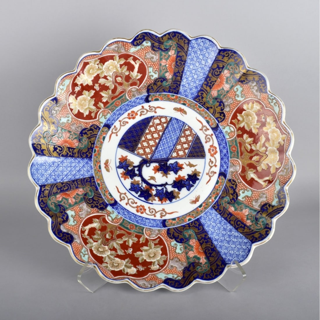 19/20th Century Scalloped Imari Charger: 19th - 20th Century Scalloped Imari Charger. Signed to bottom. 17-3/4" Dia.x 2-1/2" H. Kodner Galleries offers phone and absentee bidding at a low, flat 21% buyer?s premium without surcharge or