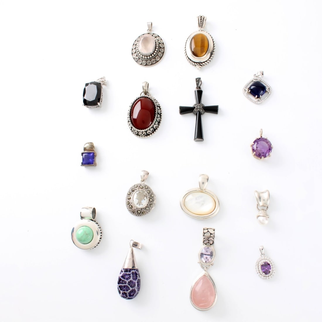 Sterling Pendants: Collection of Fifteen (15) Sterling Silver Pendants Variously accented with Color stones, hardstones and faux diamonds. Most stamped 925 or sterling. Largest measures 1-3/4" L, 7/8" W. Approx. total