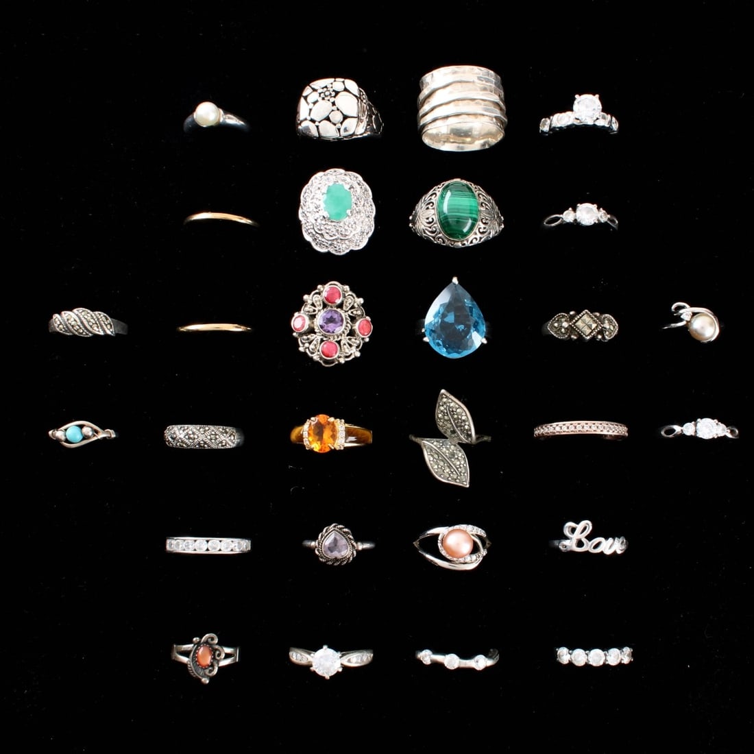 Sterling Rings: Collection of Twenty-eight (28) Vintage Sterling Silver Rings. Variously accented with color stones, pearl, hardstones and faux diamonds. Rings sizes 3 to 9-3/4. Approx. total weight: 100.46 grams.