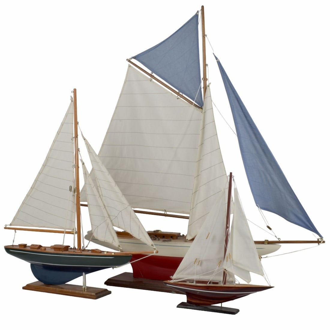Sailboat Models: Collection of Three (3) Sailboat Models. Tallest measures: 31" high, 31" long, 4-3/4" wide, middle size measures: 21" high, 19" long, 3-1/4" deep, smallest measures: 13-1/2" high, 11-1/2" long,