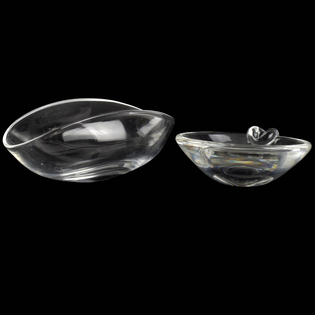 Steuben Crystal Tableware Pieces: Steuben Crystal Tableware Pieces. Both pieces signed "Steuben" in script to the bottoms. Consisting of one (1) sloping candy dish with single crimped side. Measures: 2-1/2" high, 5" diameter, one (1)