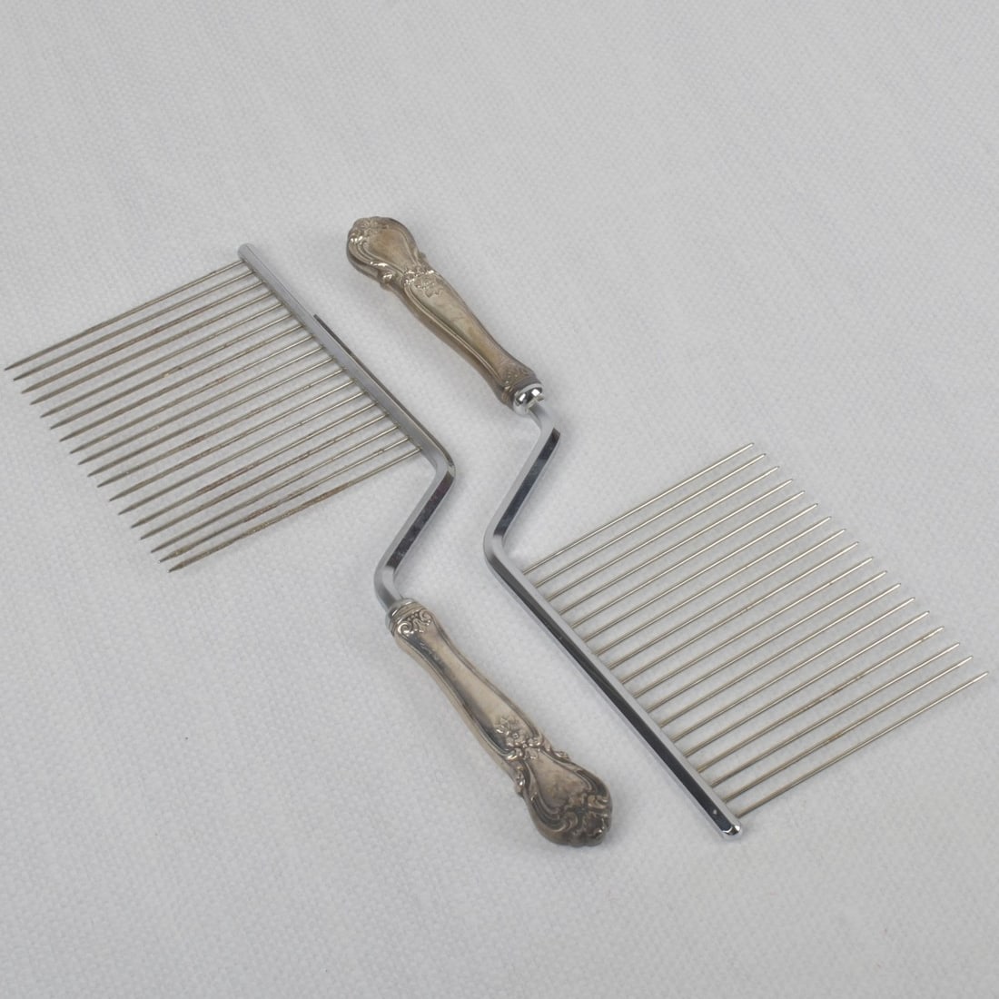 Web "Ancestry" Sterling Cake Breaker: Two (2) Webb "Ancestry" Sterling Silver Hollowware Handle Angel Food Cake Breaker. Measures: 10-7/8" long. Total gross weight including stainless steel tongs and rod: 8.40 troy ounces. Kodner