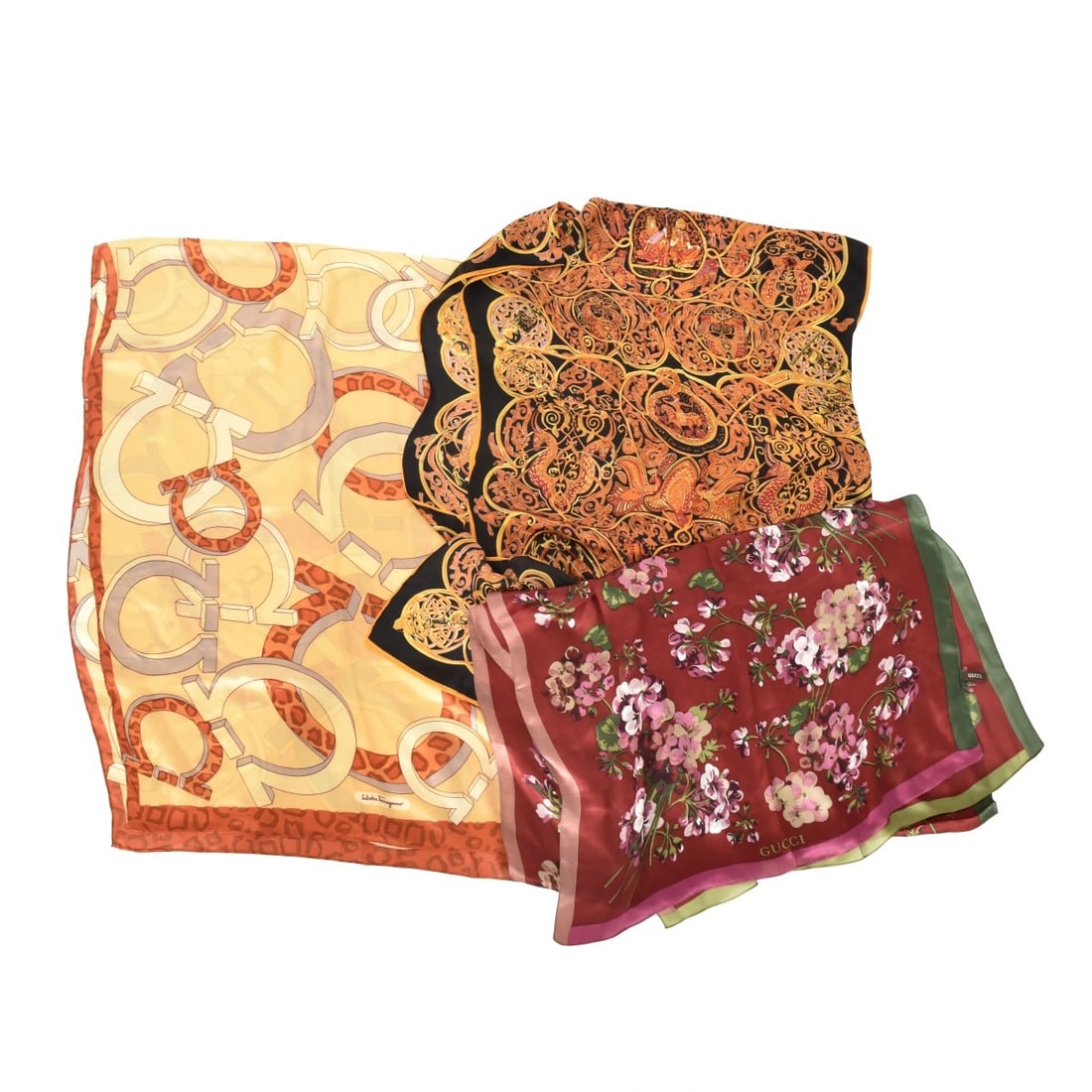 Replica Designer Silk Scarves: Replica Designer Silk Scarves. One (1) with Ferragamo tag, one (1) with Gucci tab, one (1) with no tag, probably Hermes. Measures: 25-1/2" H, 70" W. Kodner Galleries offers phone and absentee bidding 