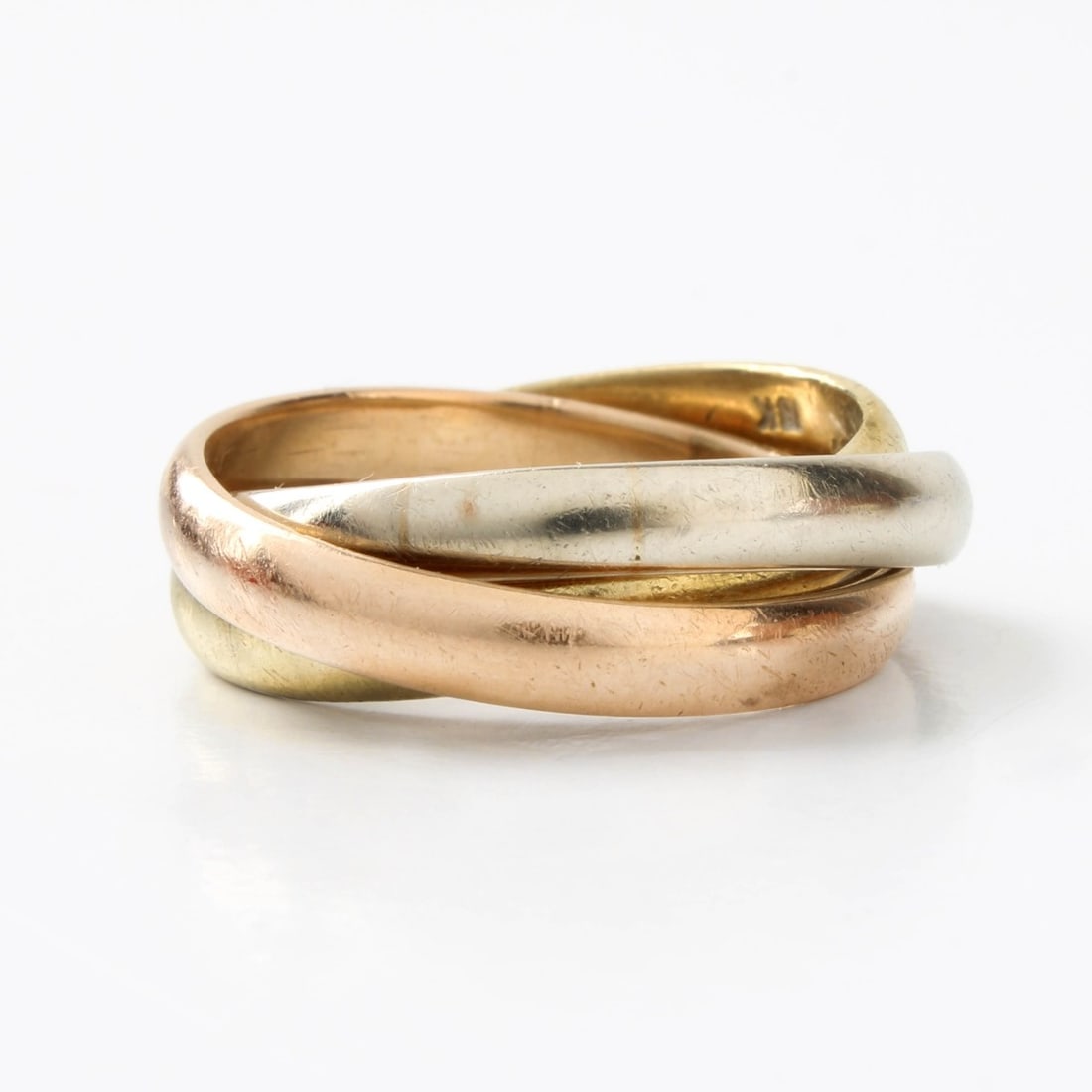 Cartier 18K Trinity Ring: Vintage Cartier 18 Karat Tri-color Gold Trinity Ring. Signed, stamped 18K. Ring size 7-3/4. Approx. weight: 11.75 grams. With Cartier box. Kodner Galleries offers phone and absentee bidding at a low,