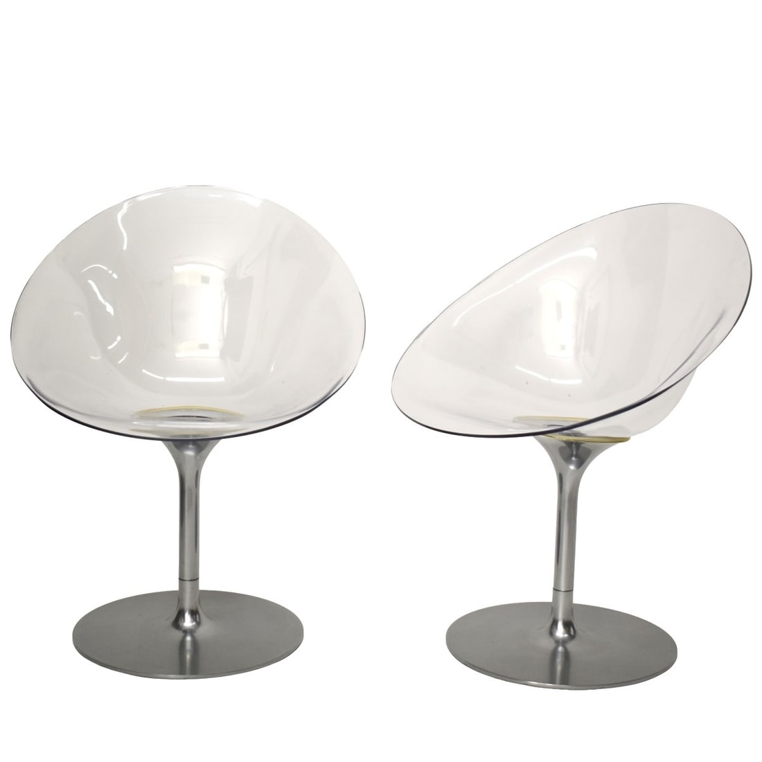 Pair of Philippe Starck Eros Chairs: Pair of Philippe Starck Eros Chairs for Kartell. Molded in clear lucite and raised on aluminum pedestal bases and a circular foot. Measures: 31" high, 21" wide, 27" deep. Kodner Galleries offers