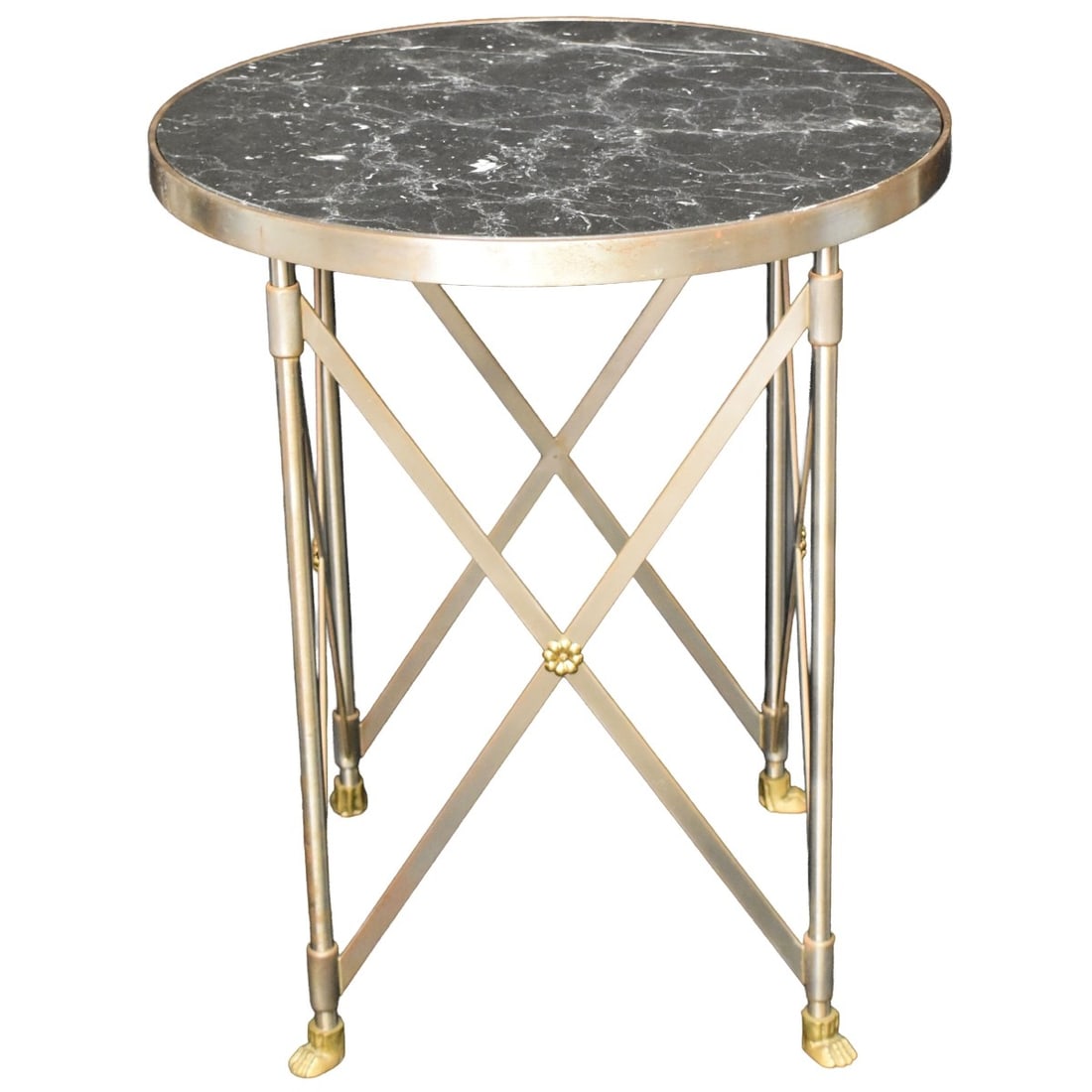 Paul M. Jones Table: Satin Finish Heavy Steel with Brass Details and a Black Veined Marble Top. Measures: 29" high, 24-1/2" diameter. Kodner Galleries offers phone and absentee bidding at a low, flat 21% buyer?s premium