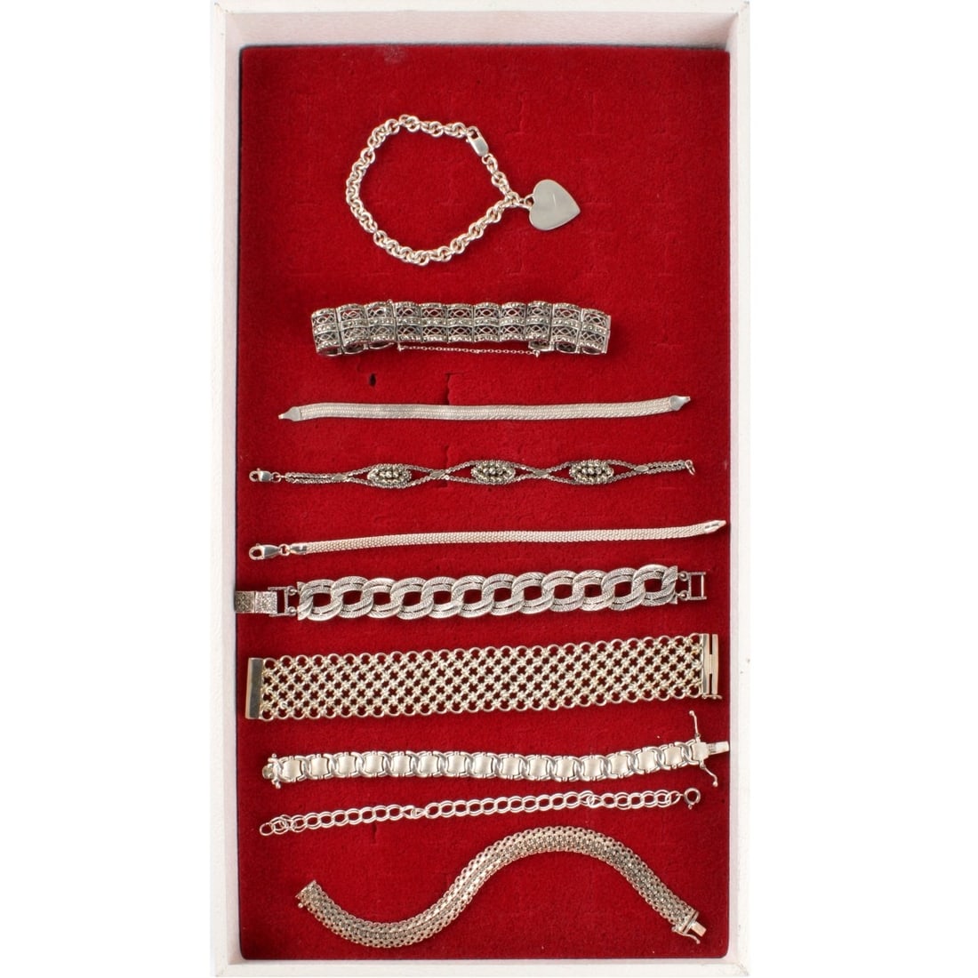 Sterling Bracelets: Collection of Ten (10) Link Bracelets. Two set with marcasites. Wide bracelet measures 7-1/4" L, 1" W. Approx total weight: 206.46 grams. Kodner Galleries offers phone and absentee bidding at a low,