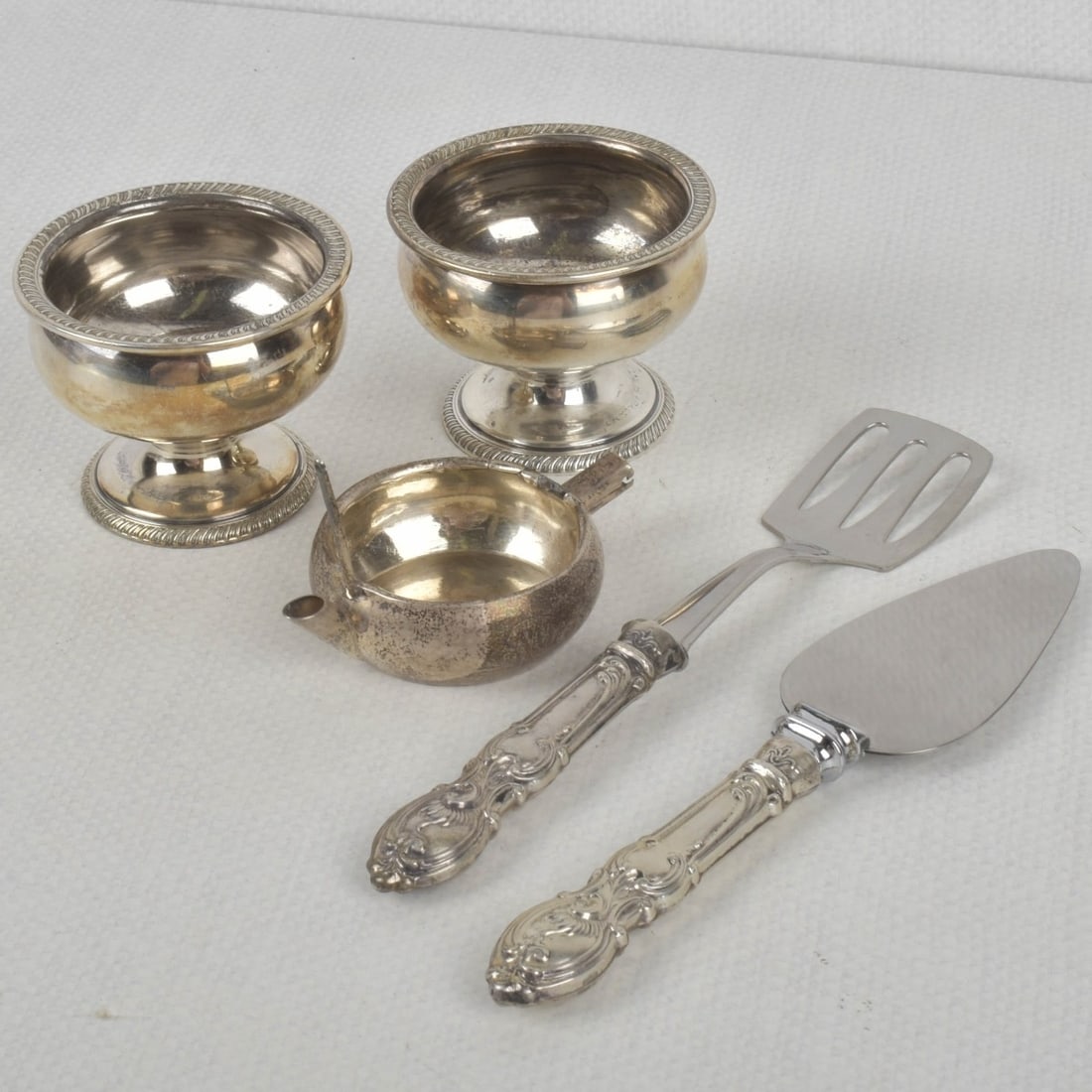 Sterling Silver Pieces: Five (5) Sterling Silver Pieces. Consisting of two (2) small footed bowls stamped with the M. Fred Hirsch Mark as well as "STERLING 4860" to the bottoms, measures: 2" high, 2-1/2" diameter, one (1)