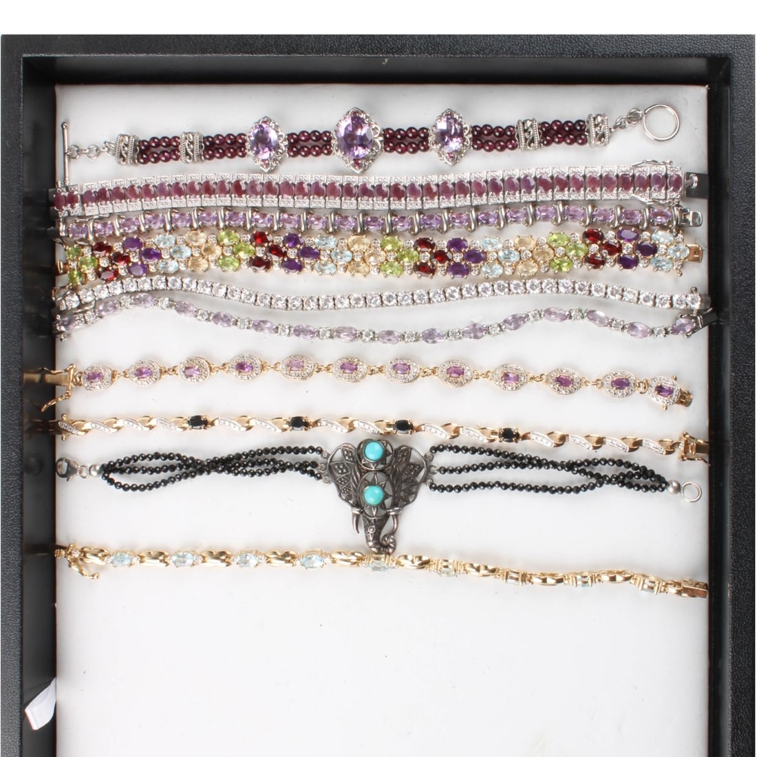 Sterling Bracelets: Collection of Ten (10) Sterling Silver Link Bracelets. Variously accented with color stones and faux diamonds. Wide multi color stone bracelet measures 7" L, 1/2" W. Approx. total weight: 166.73