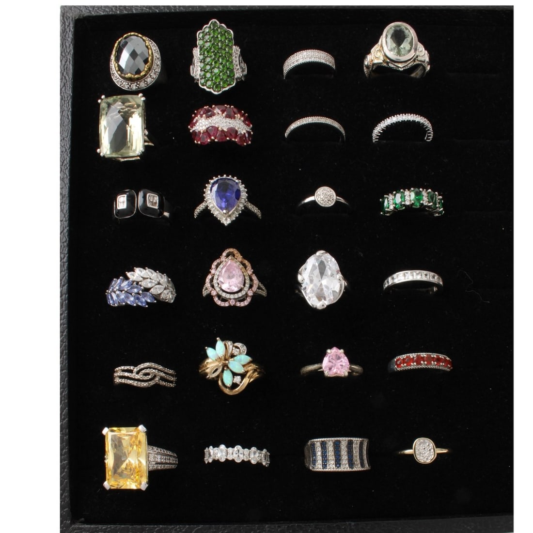 Sterling Rings: Collection of Twenty-four (24) Sterling Silver Rings. Variously accented with color stones and faux diamonds. Ring sizes 5 to 8-3/4. Approx. total weight: 110.12 grams. Kodner Galleries offers phone