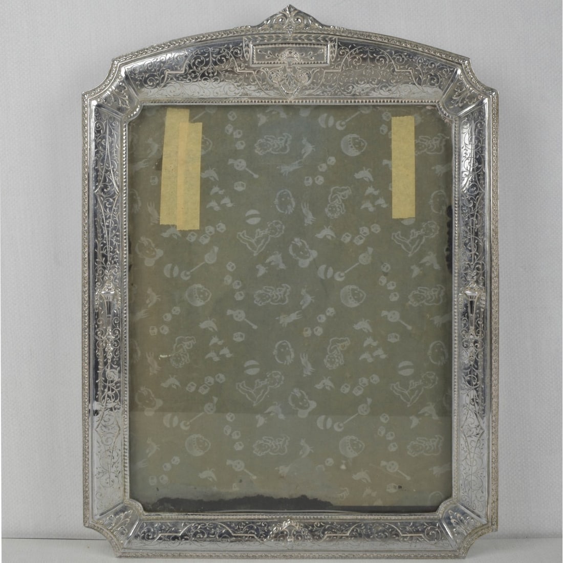 English Engraved Photo Frame: Vintage English Engraved Photo Frame. Measures: 18-1/4" high, 13-1/2" wide. Provenance: From an Important Coconut Grove, Florida Estate. Kodner Galleries offers phone and absentee bidding at a low,