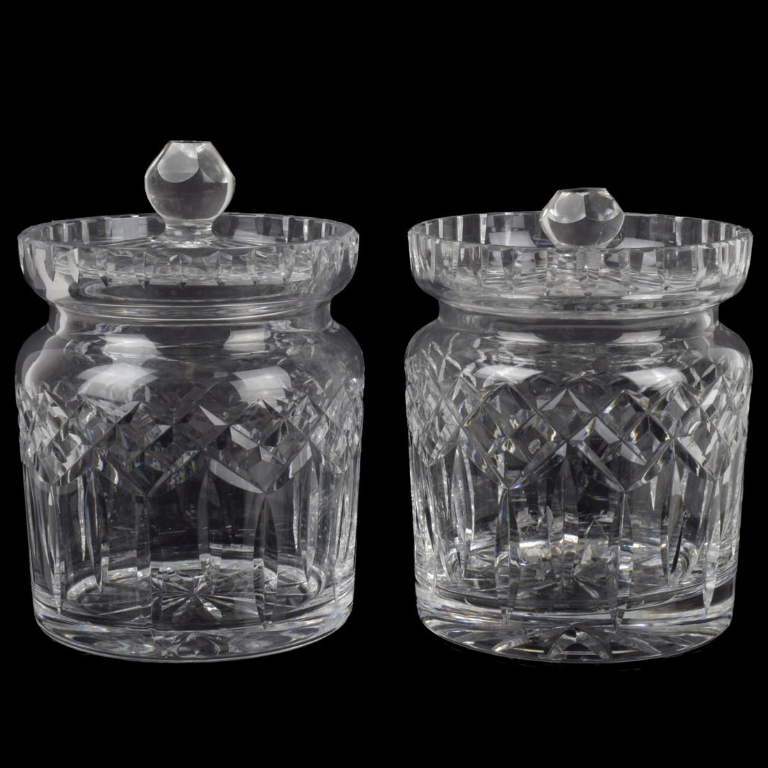 Waterford Cut Crystal: Two (2) Waterford Lismore Cut Crystal Biscuit Barrel-Jars with Corresponding Covers. Measures: 7" high, 5" diameter. Kodner Galleries offers phone and absentee bidding at a low, flat 21% buyer?s