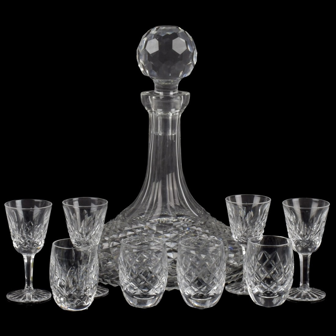 Waterford Cut Crystal: Nine (9) Waterford Cut Crystal Pieces. Consisting of: one (1) Alana ships decanter with faceted stopper, measures: 9-3/4" high, 7-1/4" diameter, four (4) Lismore cordial glasses, measures: 3-1/2"