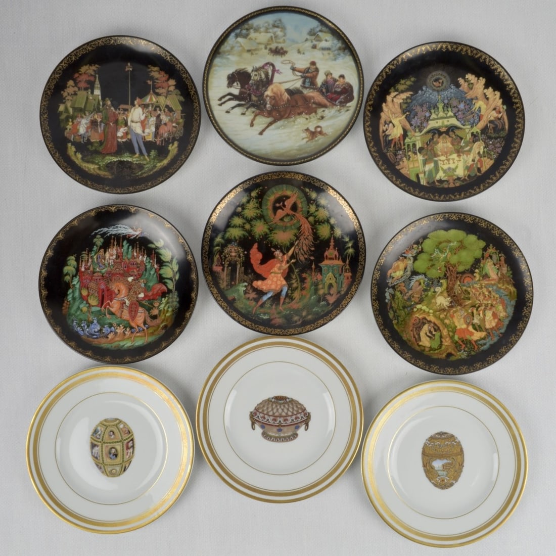 Russian Themed Porcelain Plates: Nine (9) Assorted Russian Themed Porcelain Plates. Various makers and sizes. Including Three (3) Faberge Limoges egg plates. Largest measures: 7-3/4" diameter. Kodner Galleries offers phone and absent