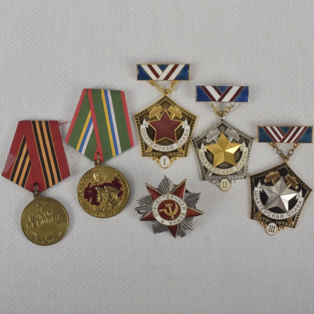 Vintage War Medals and Decorations: Six (6) Vintage Russian Vintage War Medals and Decorations with Silk Grosgrain Ribbons. 1. Minors Glory 1st Degree. 2. Minors Glory 2nd Degree. 3. Minors Glory 3rd Degree. 4. Space Cooperation Between