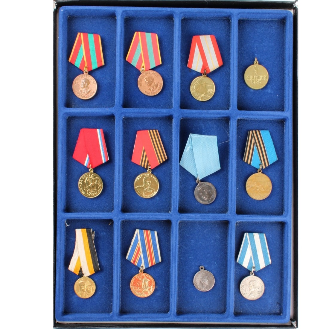 Russian Medals and Badges: Collection of Twelve 12) Russian Medals and Badges. Various campaigns and years. Some with Grosgrain ribbons. Kodner Galleries offers phone and absentee bidding at a low, flat 21% buyer?s premium with
