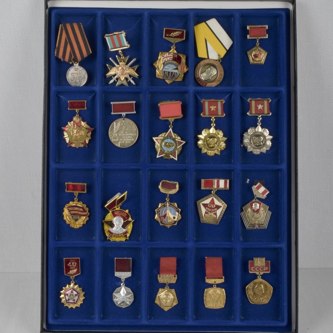 Russian and Bulgaria Medals and Badges: Collection of Twenty (20) Russian and Bulgaria Medals and Badges. Various campaigns and years. Some with Grosgrain ribbons. Kodner Galleries offers phone and absentee bidding at a low, flat 21% buyer?