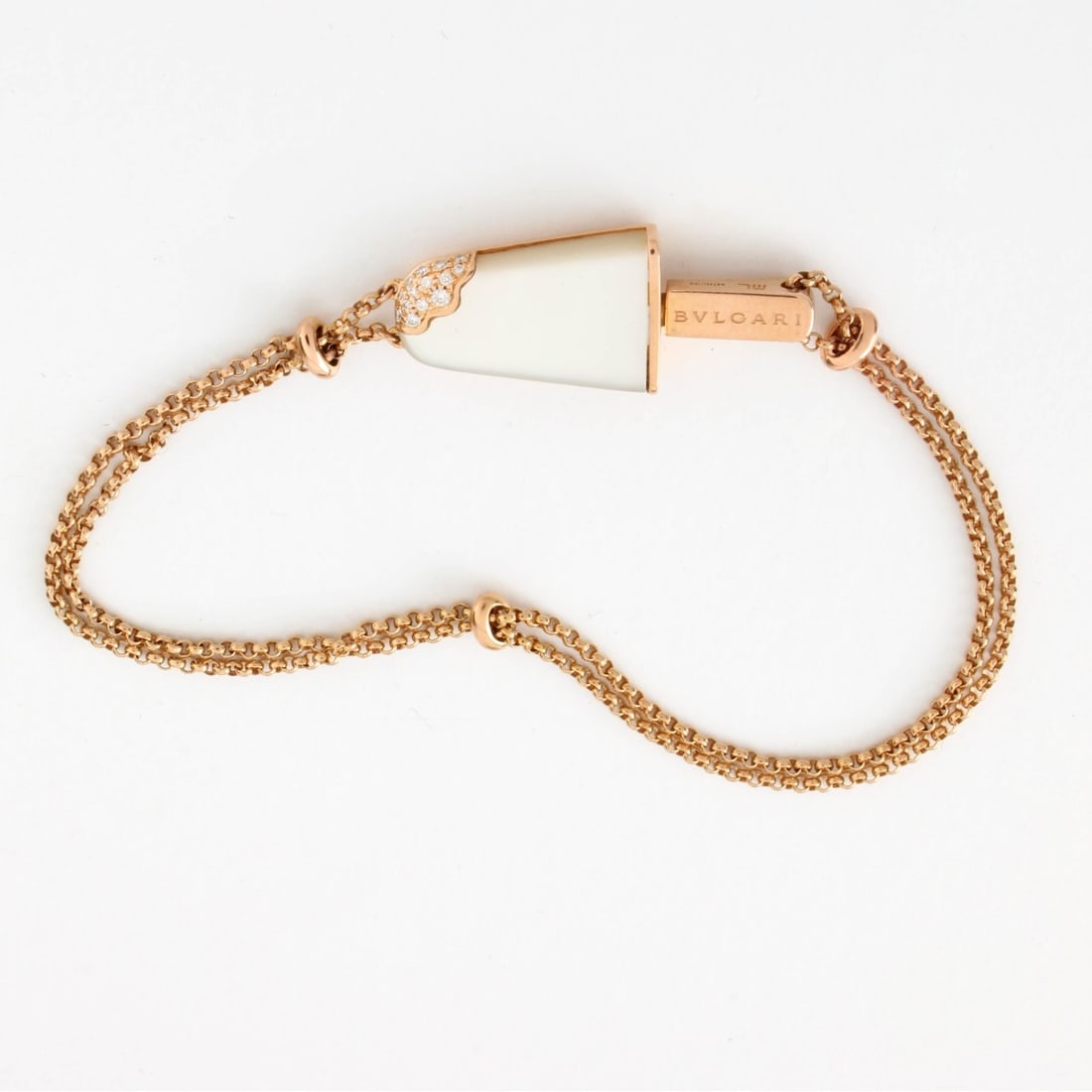 Bulgari Gelati Bracelet: Bulgari 18 Karat Rose Gold Gelati Bracelet with Mother of Pearl and Pave Set Diamond Popsicle Charm with Bulgari Box. Signed. Measures 6-1/4" L, 3/8" W (at charm). Approx. weight: 5.21 grams. Kodner