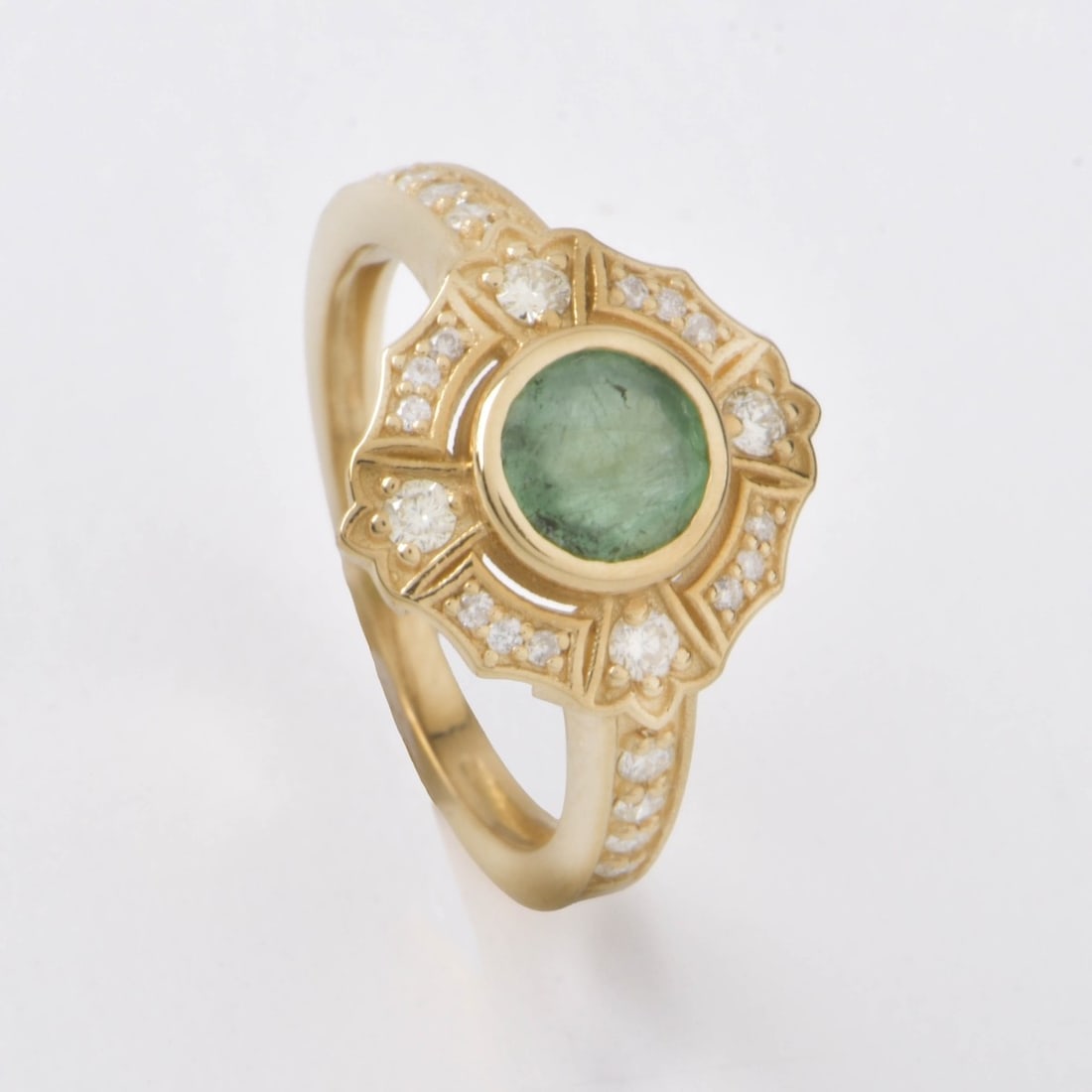 UGS Emerald, Diamond and 14K Ring: United Gemological Services .84 Carat Round Cut Emerald and 14 Karat Yellow Gold Ring Accented with Small Round Cut Diamonds. Emerald with good color. Ring stamped 14K. Ring size 7. Approx. weight: