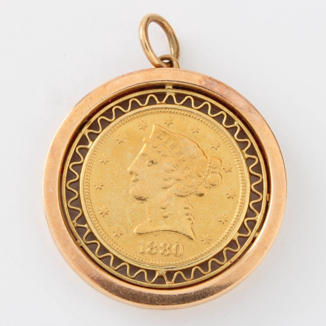 US $5 Gold Coin and 14K Pendant: US 1880 $5 Gold Coin Mounted as a Pendant with 14 Karat Yellow Gold Bezel. Condition: Good condition. Please note this coin is not professionally graded. Estimate: $1000.00 - $1500.00 In-House