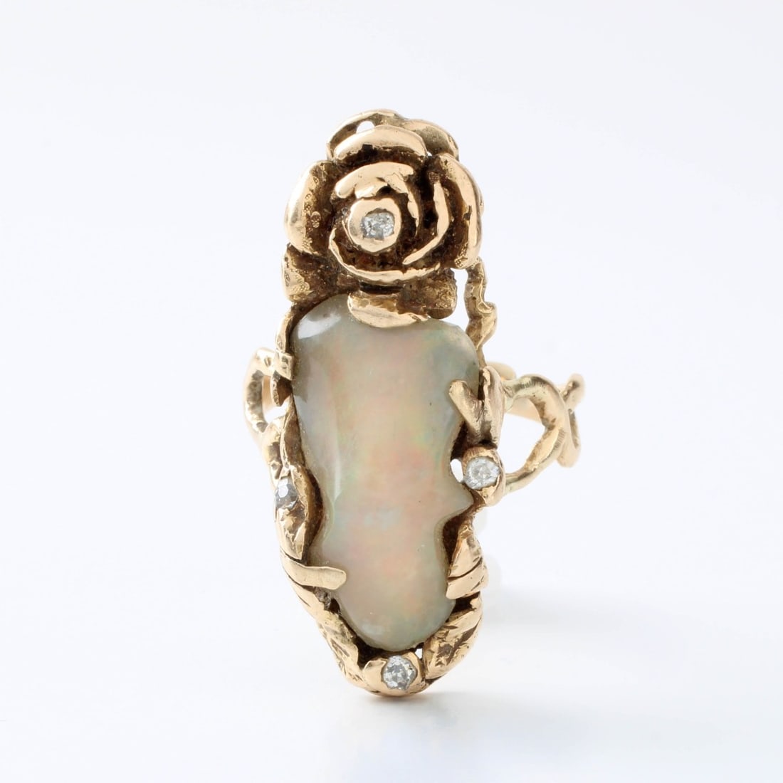 Opal and 18K Ring: Art Nouveau Opal and, Small Round Cut Diamond and 18 Karat Yellow Gold Ring. Opal with good play of color. Ring size 8-1/2. Approx. weight: 12.95 grams. Kodner Galleries offers phone and absentee bidd