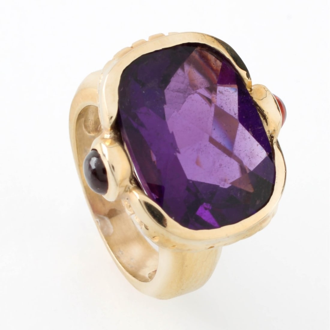 Amethyst and 14K Ring: Rose Cut Amethyst and 14 Karat Yellow Gold Ring. Amethyst with vivid color. Stamped 14K. Ring size 5. Approx. weight: 11.44 grams. Kodner Galleries offers phone and absentee bidding at a low, flat