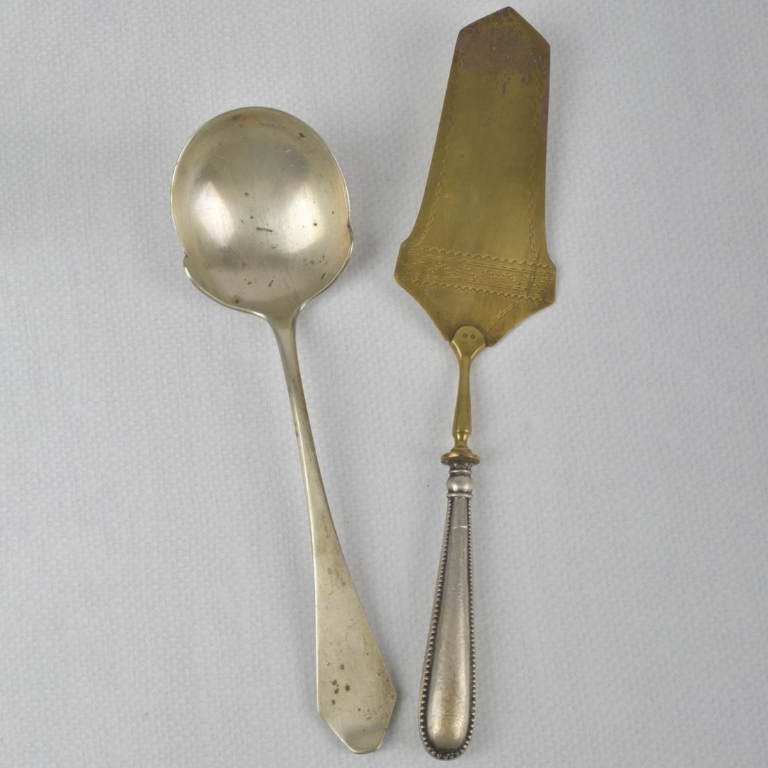 800 Silver Serving Pieces: Two (2) Pieces 800 Silver Serving Pieces. Consisting of one (1) B. Knoblauch 800 silver serving spoon, measures: 8-7/8" long, weighs: 2.44 troy ounces, one (1) 800 silver hallow handle pie server