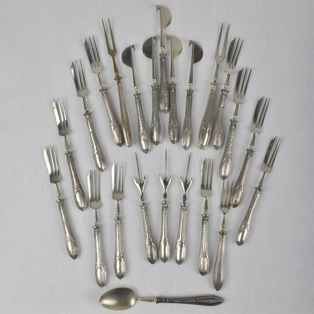 Silver Serving Pieces: Lot of Twenty-three (23) Silver Serving Pieces. Spoon measures: 6-1/2" long. Kodner Galleries offers phone and absentee bidding at a low, flat 21% buyer?s premium without surcharge or hidden fees.
