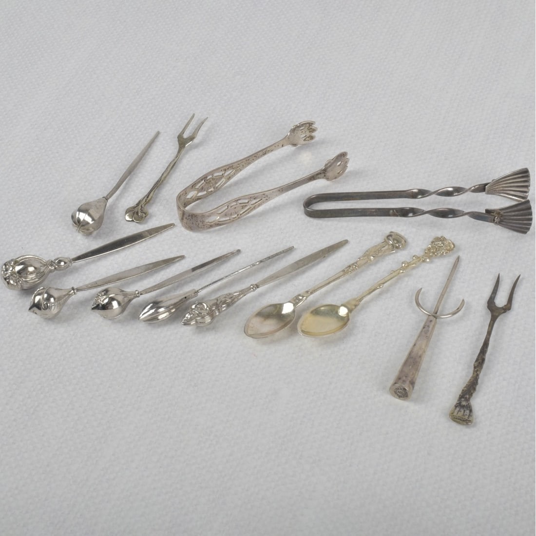 Lot of Small Sterling Serving Pieces: Lot of Small Sterling Silver and Silver Serving Pieces. Total approximate weight: 83.60 grams. Kodner Galleries offers phone and absentee bidding at a low, flat 21% buyer?s premium without surcharge