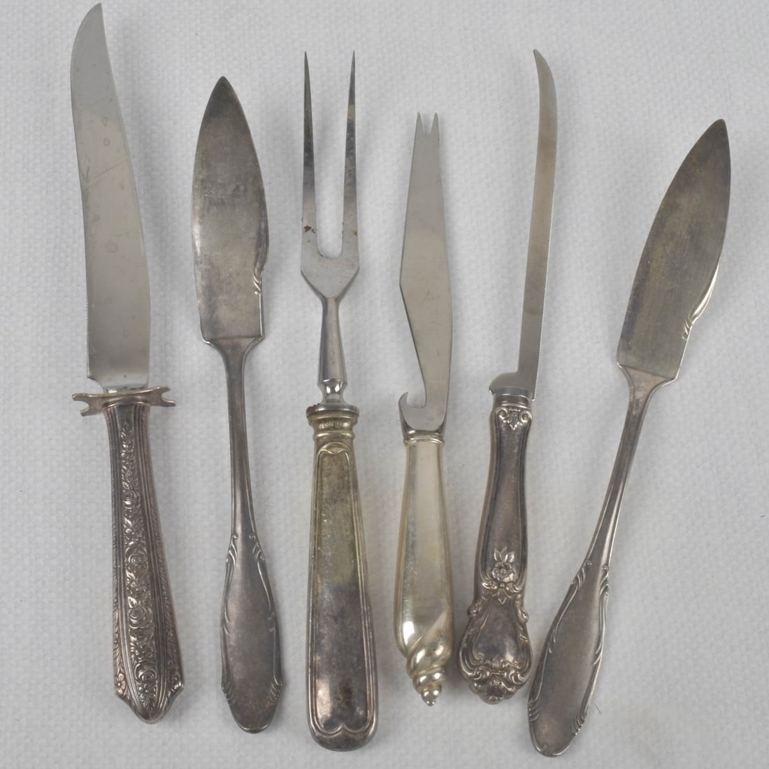 Vintage Silver Serving Pieces: Five (5) Vintage Silver Halloware Serving Pieces. Consisting of one (1) 800 silver serving fork, measures: 9-1/2" long, two (2) 900 silver small pastry servers, measures: 8-3/4" long, one (1) small st