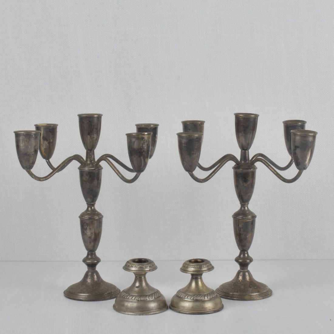 Sterling Silver and Silver Table Ware: Sterling Silver and Silver Candlesticks and Candelabra Arrangement. Consisting of one (1) pair of weighted Empire sterling silver candelabras, properly stamped to the bottom, measures: 11" high,