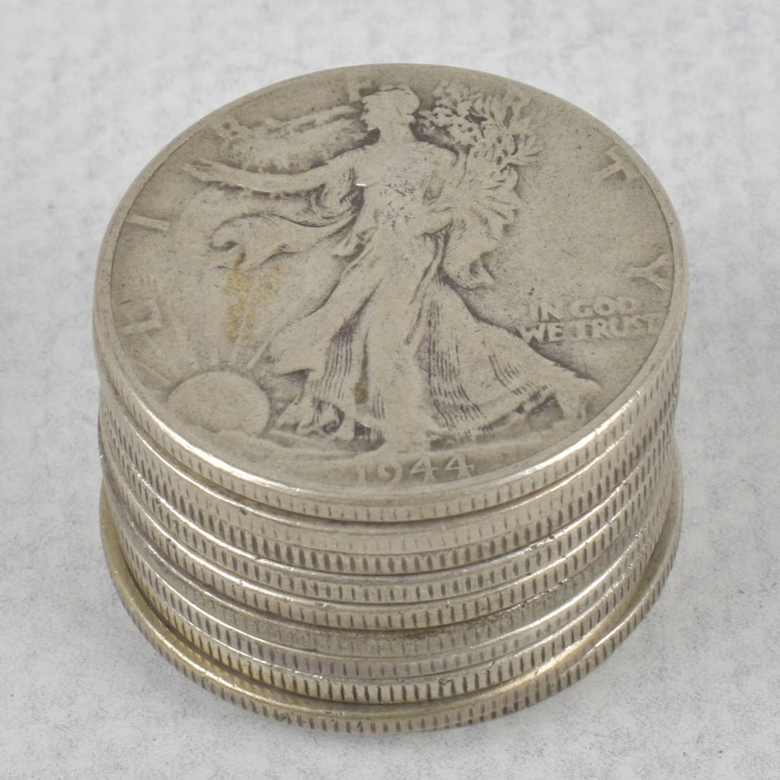 US Walking Liberty Silver Half Dollar: Ten (10) US Walking Liberty Silver Half Dollar Coins. Circulated various years 1938-1944. Total weight: 391.01 grams. Kodner Galleries offers phone and absentee bidding at a low, flat 21% buyer?s prem