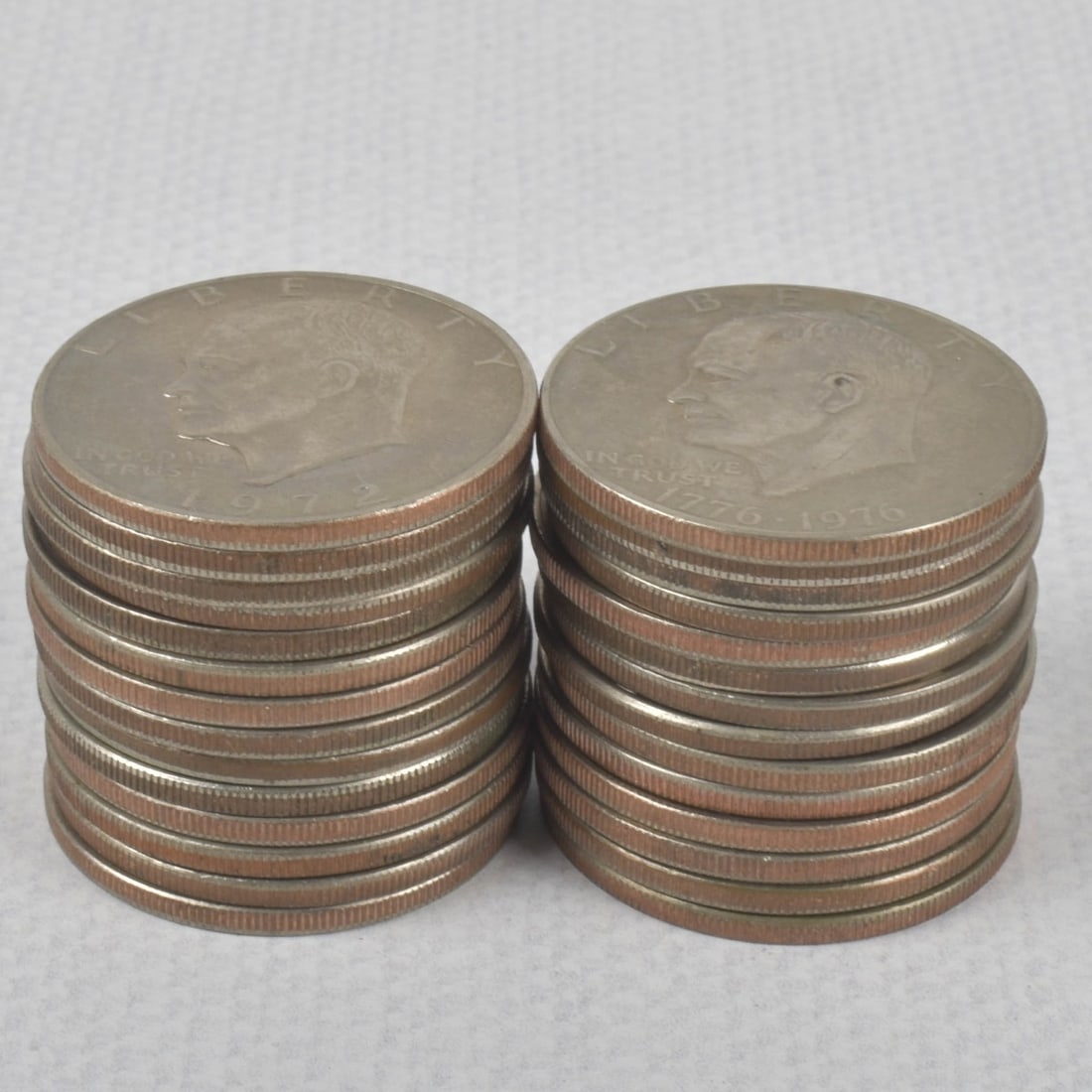 Eisenhower Liberty Dollar Coins: Twenty-eight (28) Eisenhower Liberty Dollar Circulated Coins. Various years 1971-1976. Total weight: 630 grams. Kodner Galleries offers phone and absentee bidding at a low, flat 21% buyer?s premium wi