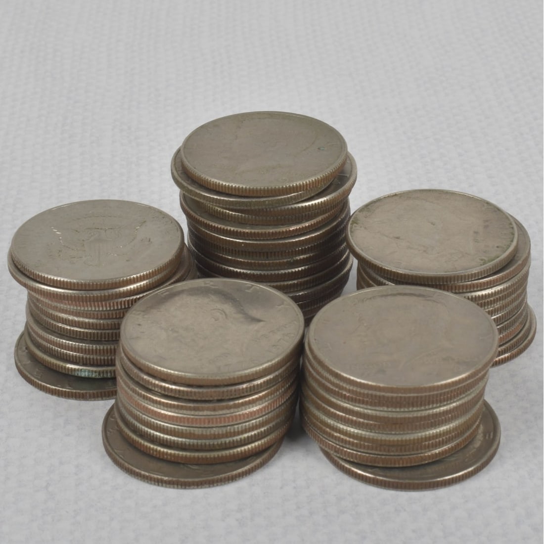 Kennedy Liberty Half-dollar Coins: Fifty-one (51) Kennedy Half-dollar Circulated Coins. Various years 1971-1978. Total weight: 570.01 grams. Kodner Galleries offers phone and absentee bidding at a low, flat 21% buyer?s premium without