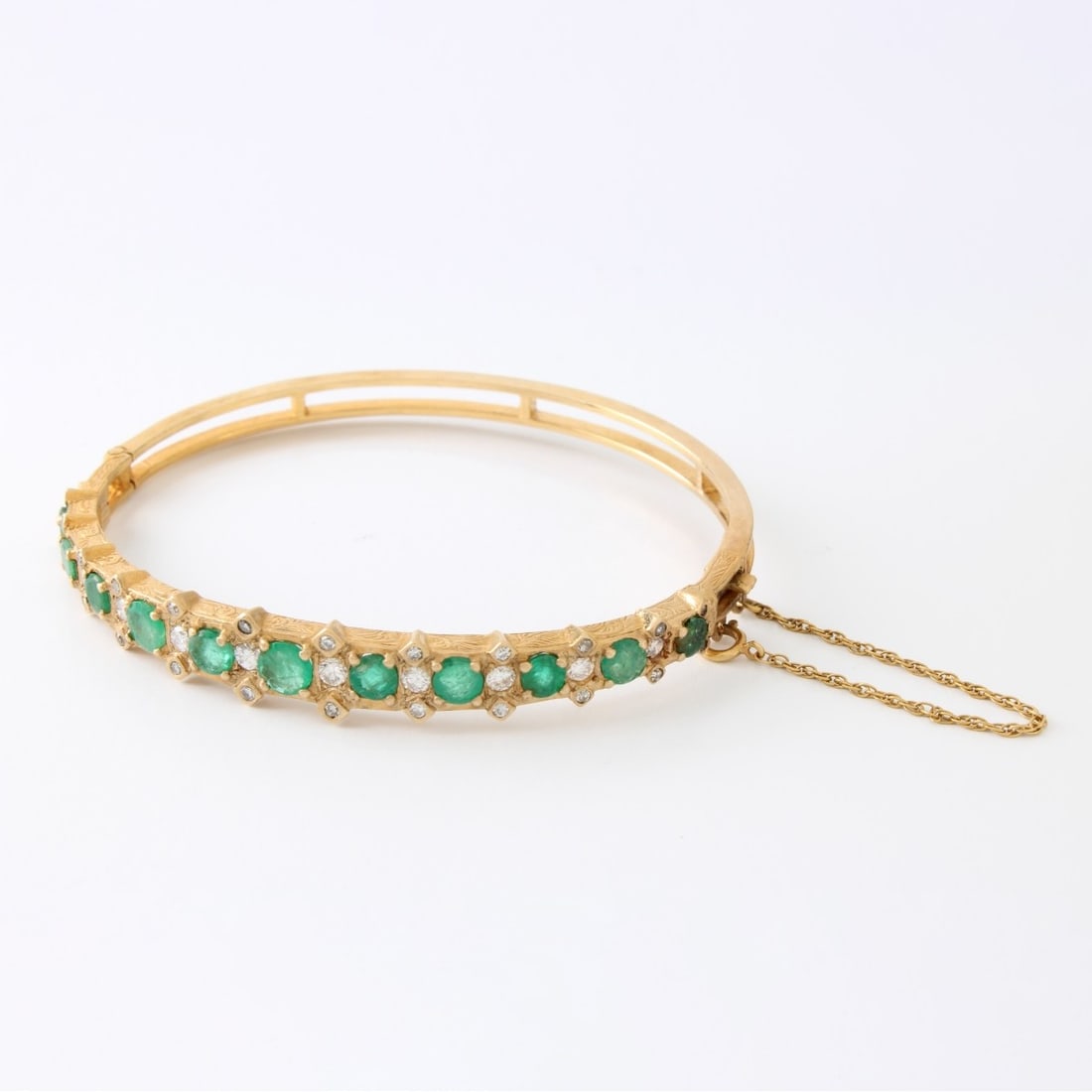 Emerald, Diamond and 14K Bracelet: Fine Antique Approx. 2.50 Carat TW Round Cut Colombian Emerald, 1.20 Carat Round Brilliant Cut Diamond and 14 Karat Yellow Gold Hinged Bangle Bracelet. Emeralds with good color. Diamonds F-G color,
