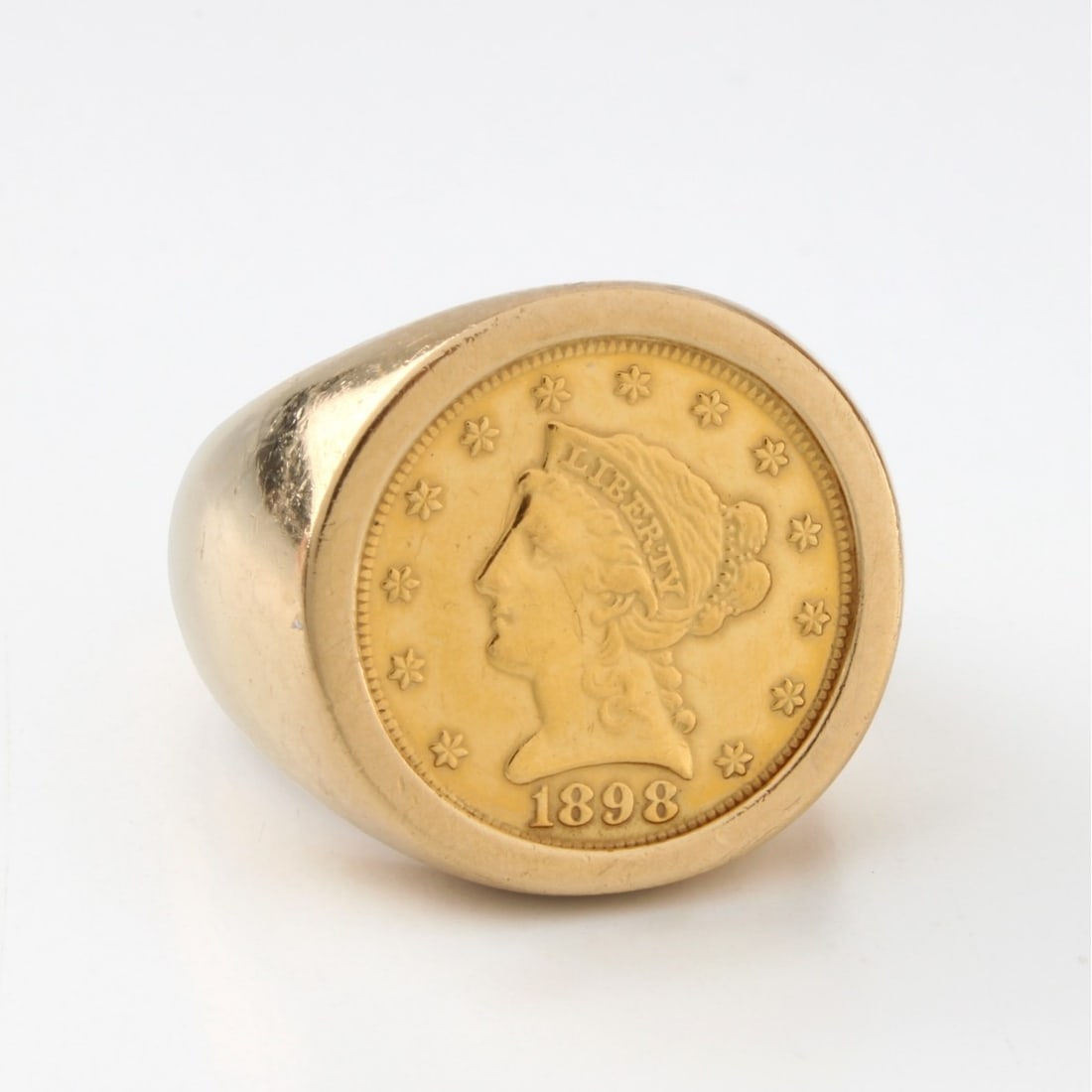 Liberty Head Gold Coin & 14K Ring: Vintage US 1898 $2-1/2 Gold Coin and 14 Karat Yellow Gold Ring. Ring size 7-1/2. Approx. total weight: 13.24 grams. Kodner Galleries offers phone and absentee bidding at a low, flat 21% buyer?s premiu