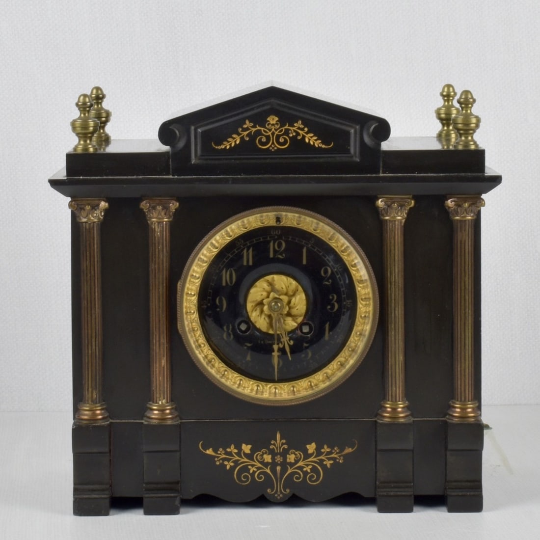Le Boutillier Paris, French Clock: Le Boutillier Paris, French Slate Engraved Mantle Clock with Key. Enamel face with Roman numerals, marked Le Boutillier & Co. Paris to the face. Beveled glass crystal. Eight day mechanical movement wi