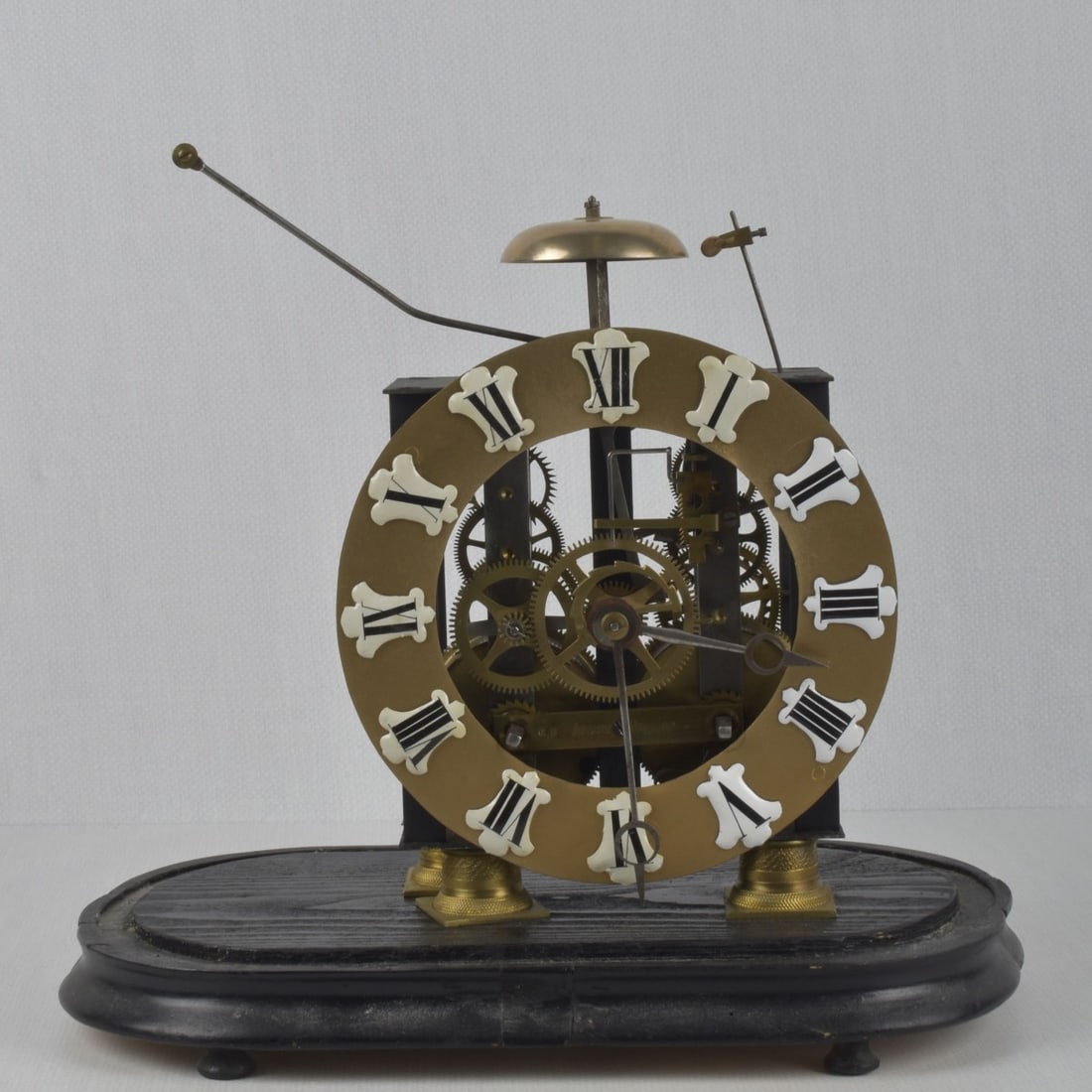 Antique Skeleton Clock: Antique Skeleton Clock with Glass Dome. Glass measures: 18" high, 12-1/2" wide, 6-3/4" deep. Kodner Galleries offers phone and absentee bidding at a low, flat 21% buyer?s premium without surcharge or
