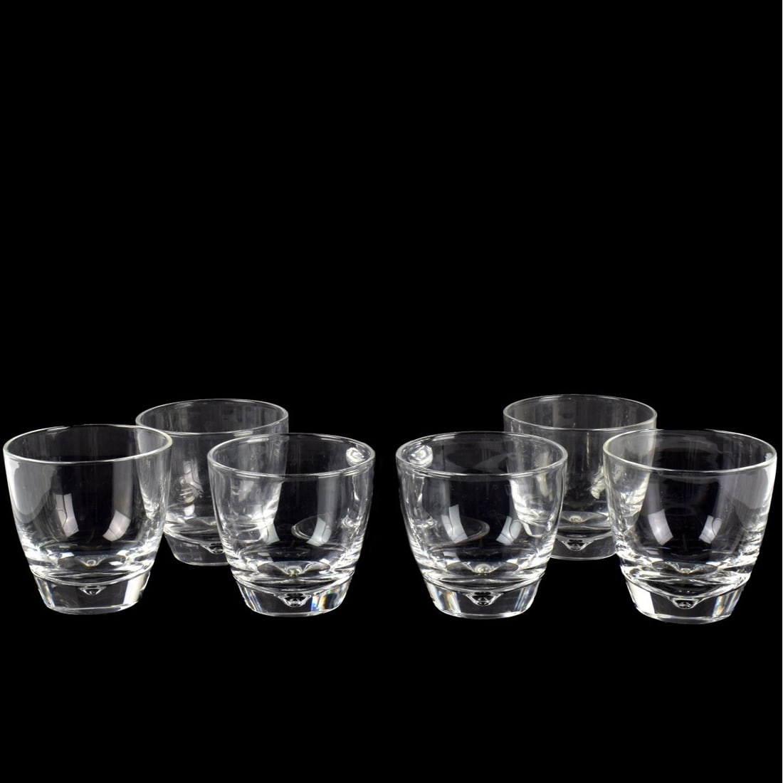 Steuben Crystal Glasses: Steuben (American) Crystal Six (6) Rocks Glasses. Each signed "Steuben" in script. Measures: 3-1/4" high, 3-1/2" diameter. Kodner Galleries offers phone and absentee bidding at a low, flat 21%
