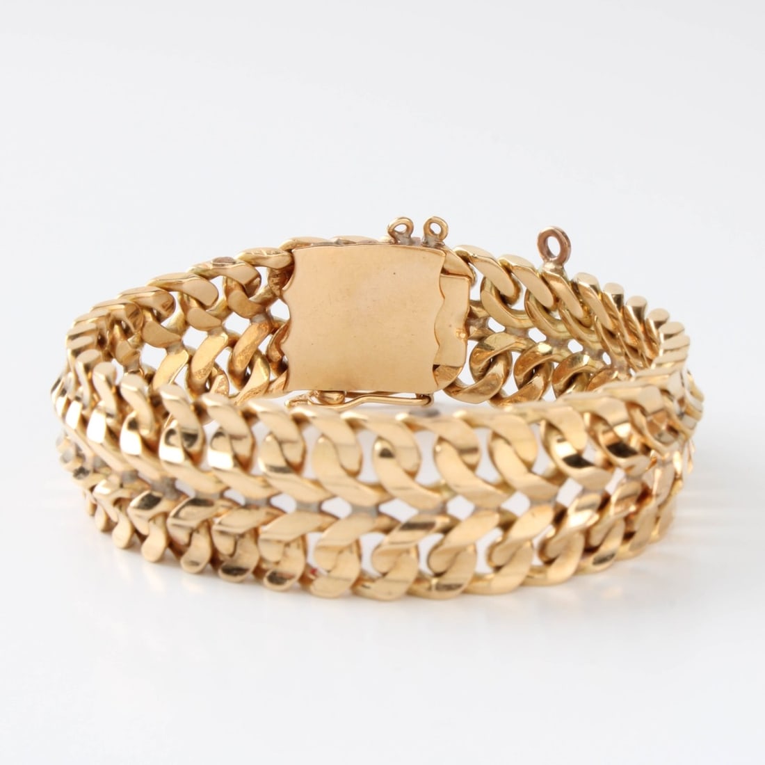 14K Bracelet: Vintage Retro Design 14 Karat Yellow Gold Double Row Flexible Cuban Link Bracelet. Measures 7-3/4" L. Approx. weight: 38.75 grams. Kodner Galleries offers phone and absentee bidding at a low, flat 21%