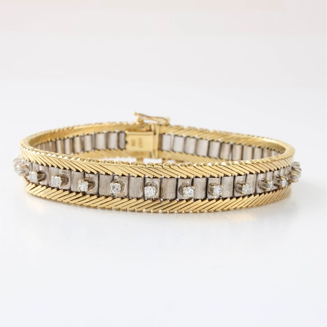 Diamond and 18K Bracelet: Vintage Italian Approx. 1.0 Carat TW Twenty-nine Single Cut Diamond and 18 Karat Yellow and White Gold Line Bracelet. Diamonds G-H color, VS1-VS2 clarity. Stamped 18K. Measures 7-1/4" L. Approx.