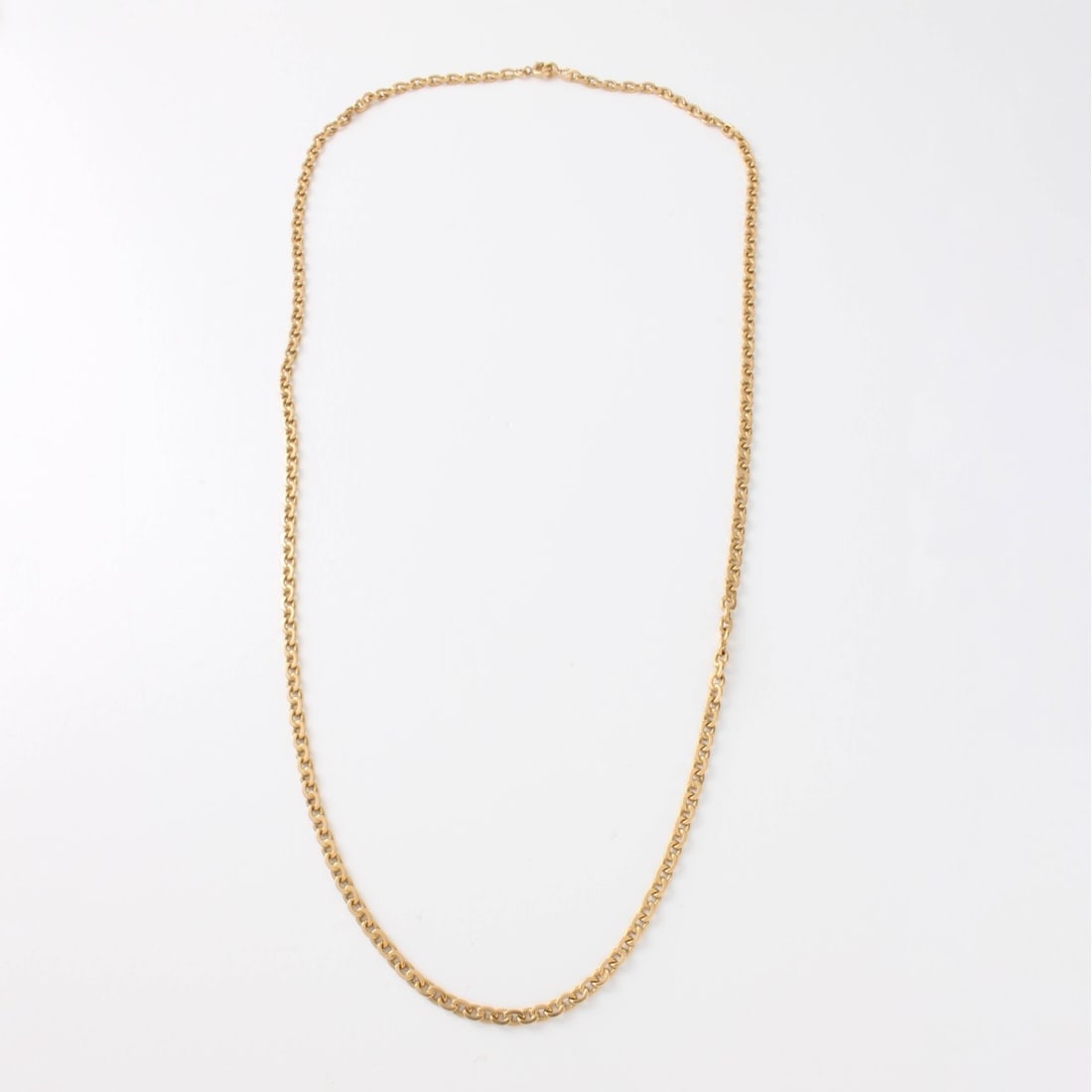 18K Necklace: Vintage 18 Karat Yellow Gold Mariner Link Chain Necklace. Measures 24" L. Approx. weight: 12.2 grams. Kodner Galleries offers phone and absentee bidding at a low, flat 21% buyer?s premium without