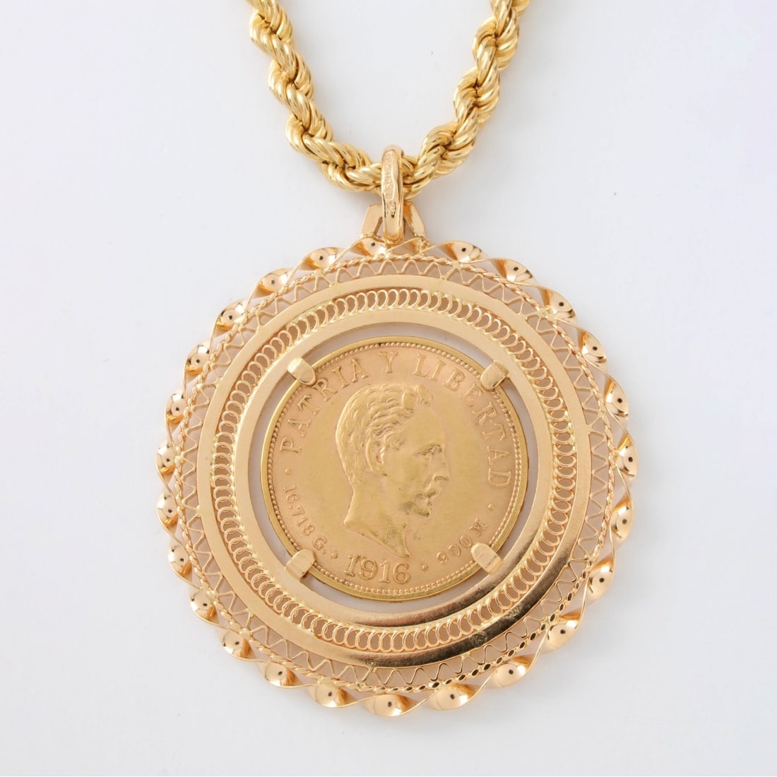 18K Chain with Gold Coin Pendant: Vintage Italian 18 Karat Yellow Gold Rope Link Chain Necklace with an 18 Karat Yellow Gold Bezel Set Mexican Diez Pesos .900 Fine Gold Coin. Chain measures 30" L. Pendant measures 1-1/2" diam. Approx.